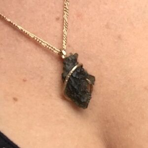 Genuine Moldivite stone wrapped in copper pendant